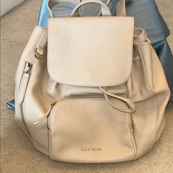 cole haan leather flap backpack Grand Ambition Convertible Magnetic flap closure with buckle detail Cole Haan Women's Alexandria Small